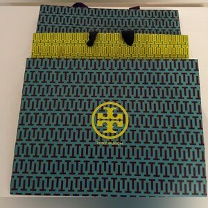 4 TORY BURCH GIFT BAGS (small smudge one bag) Larger bag w/worn area.